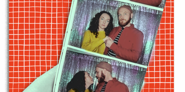 A hand holds up a photobooth strip in which Illustrators Grace Manno and Dashiell Kirk are posed
