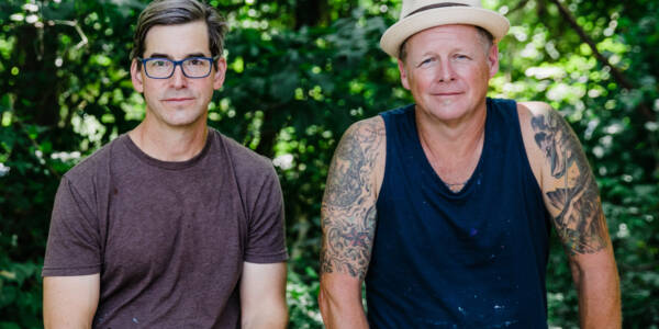 Matt Lively and Ed Trask posed together outdoors along the james river photo by Janpim Wolf