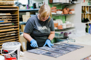 Woman making art in screen printing room at VisArts RVA