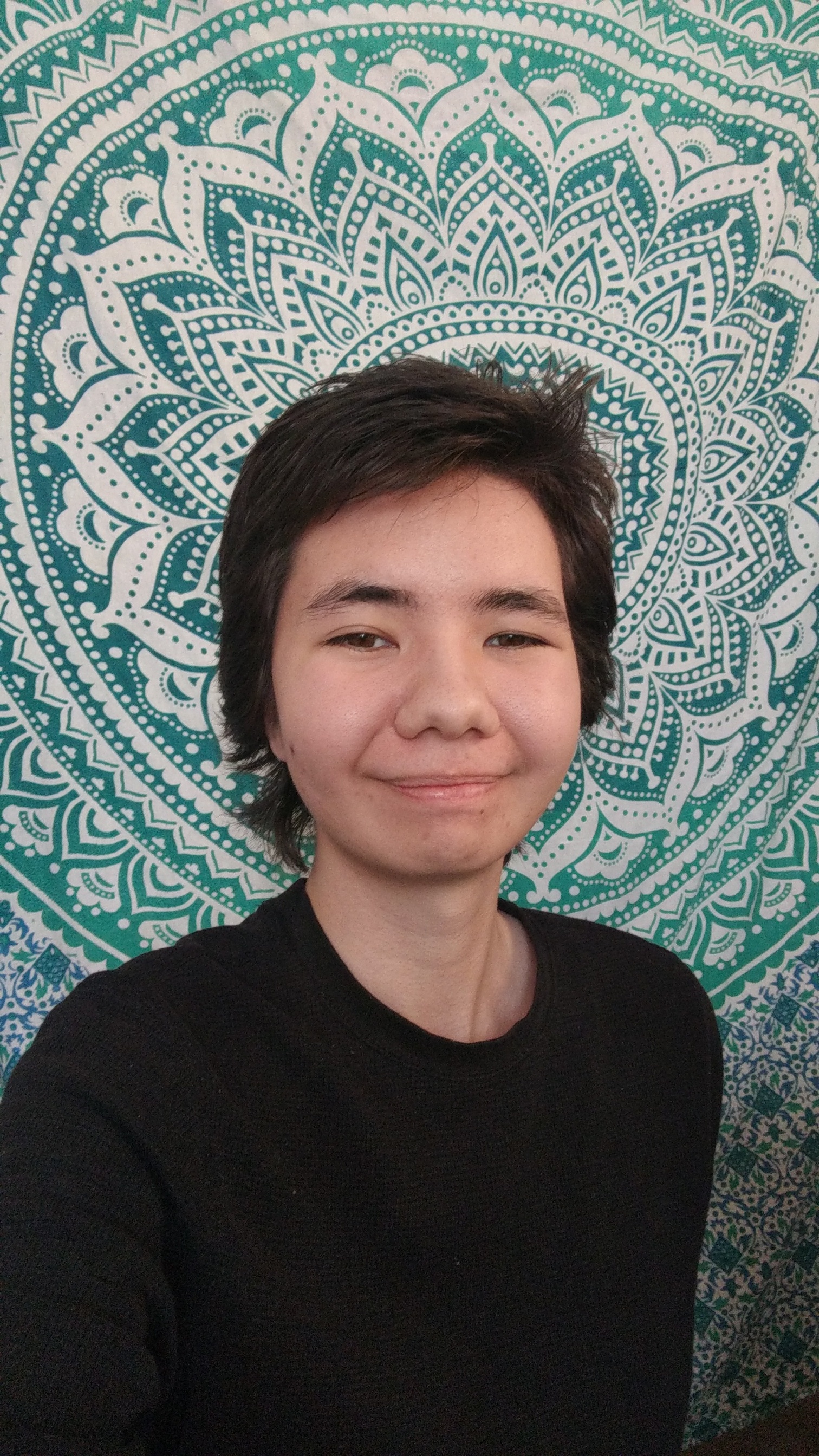 headshot of visarts teacher Avery Nguyen